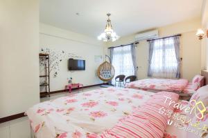 Postel nebo postele na pokoji v ubytování Hometown Times Homestay