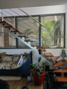 Posezení v ubytování CHAMBRE CHEZ L HABITANT PISCINE VUE MER SDB et TERRASSE PRIVEE