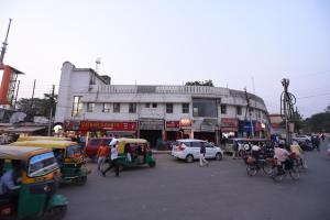a busy city street with cars and people on the street at Hotel Mayur in Gorakhpur