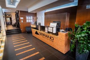 a stand in the lobby of a hotel at Serrano Residencial Hotel in Juiz de Fora