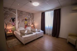 Postel nebo postele na pokoji v ubytování Mokka Apartman Szeged
