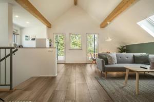 a living room with a couch and a table at Ferienwohnung Marla in Eriskirch