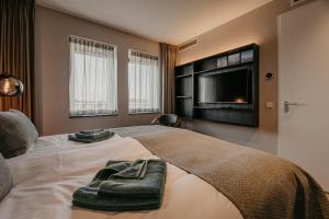Ένα ή περισσότερα κρεβάτια σε δωμάτιο στο Appartement Residence Oude Haven Colijnsplaat