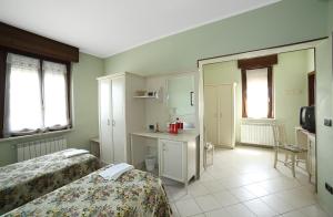 Letto o letti in una camera di Albergo Il Gufo