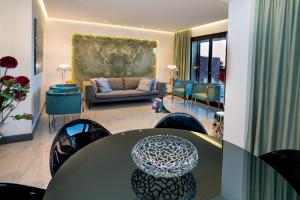 A seating area at Luxury Beachfront Apartment Taormina Pool and Parking