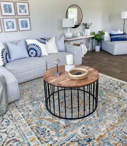 a living room with a couch and a coffee table at The Beach House at Seascape Steps from the Beach, Marina and Shops! in West Palm Beach