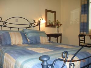 Ένα ή περισσότερα κρεβάτια σε δωμάτιο στο En Ermoupoli