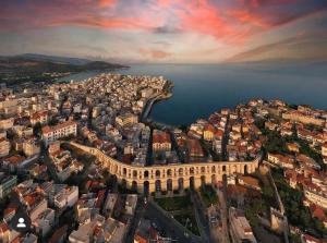 an aerial view of a city and the ocean at Overwave Apartment in Kavála