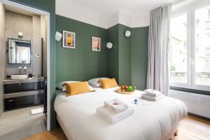 En eller flere senge i et værelse på Jardin des Plantes - Amazing 2BR/6P apartment