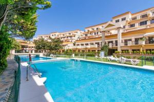 Bazén v ubytovaní OleHolidays 603 Romana Playa primera linea playa alebo v jeho blízkosti