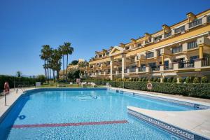 Bazén v ubytovaní OleHolidays 603 Romana Playa primera linea playa alebo v jeho blízkosti