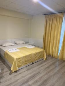 Ένα ή περισσότερα κρεβάτια σε δωμάτιο στο КОМПЛЕКС ОКЕЙ