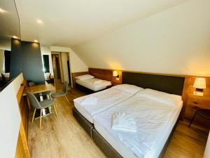 Postel nebo postele na pokoji v ubytování Villa Pinus Slovenský raj - Hotel Čingov dependance