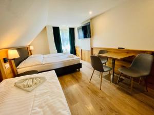 Postel nebo postele na pokoji v ubytování Villa Pinus Slovenský raj - Hotel Čingov dependance