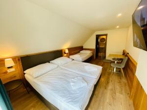 Postel nebo postele na pokoji v ubytování Villa Pinus Slovenský raj - Hotel Čingov dependance