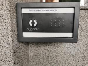 a soap dispenser on a wall in an airport at Ferienwohnung - Auszeit im Schwarzwald in Schwanau