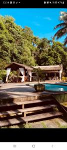 a small tree in a pot next to a swimming pool at Club MV Saco do Céu in Abraão