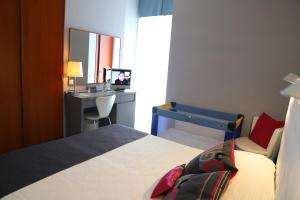 Postel nebo postele na pokoji v ubytování Hotel Metropol