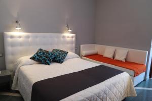 Postel nebo postele na pokoji v ubytování Hotel Metropol