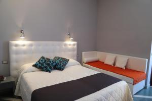 Postel nebo postele na pokoji v ubytování Hotel Metropol