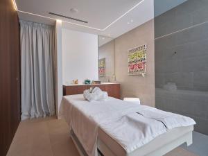 Postel nebo postele na pokoji v ubytování Hotel L'Esagono