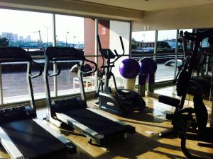 a gym with several cardio machines in a room at Oceanview Luxury, Pool, Near Tour Boats & Beach in Puerto Vallarta
