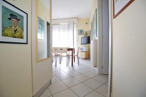a hallway leading to a living room with a table at Sirena Apartments in Lido degli Estensi