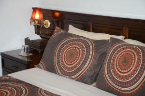 Ένα ή περισσότερα κρεβάτια σε δωμάτιο στο Magnolia Place Guest Houses