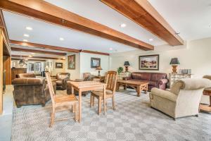 a large living room with furniture and a ceiling at The Valley Inn, Ascend Hotel Collection in Waterville Valley