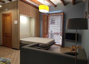 Postel nebo postele na pokoji v ubytování Apartaments Falset