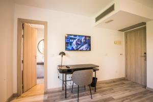 TV a/nebo společenská místnost v ubytování Hotel Pombal Rooms