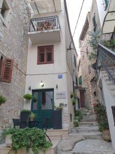 a building with a green door in an alley at House Gorica in Šibenik