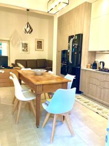 a kitchen with a wooden table and chairs at Casa Buccari in Venice