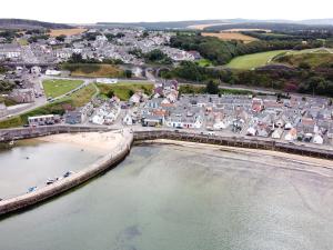 an aerial view of a town next to the beach at 85 Seatown in Cullen