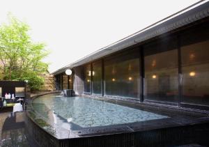 a large swimming pool in a large building at APA Hotel Kanazawa Ekimae in Kanazawa