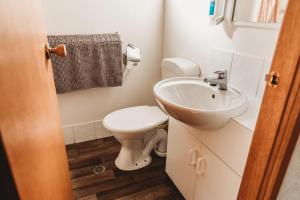 a bathroom with a toilet and a sink at G'Day Parks Ararat in Ararat