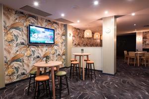 TV a/nebo společenská místnost v ubytování Links Hotel