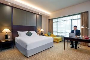 Postel nebo postele na pokoji v ubytování Eastin Hotel Kuala Lumpur