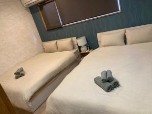 Postel nebo postele na pokoji v ubytování #良いロケーション #割引セール #BBQ可能 #長期滞在歓迎 -- Kokopelli House NAGO --