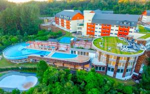an aerial view of a building with a swimming pool at Golden Laghetto Resort Gramado in Gramado