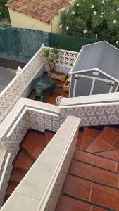 a set of stairs leading to a patio with a table at LA CAMPANA in Orihuela Costa