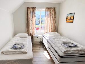 Ένα ή περισσότερα κρεβάτια σε δωμάτιο στο 11 person holiday home in VEVANG-By Traum