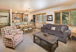 a living room with a couch and a table at Townsend Place B-106 condo in Beaver Creek