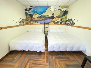 Postel nebo postele na pokoji v ubytování 鳳奶客棧 + 14 fotografií