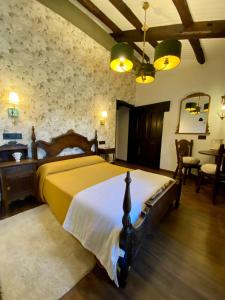 a bedroom with a large bed in a room at Casa Brandariz in Santa Maria de Arzua