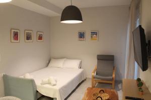 A bed or beds in a room at Plession Apartment