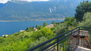 a view of a lake from a balcony at Villetta Vella Miralago by Garda Domus Mea in Tremosine Sul Garda