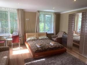 Postel nebo postele na pokoji v ubytování Villa Gāles Hotel