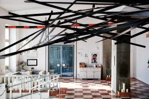 a large room with a ceiling with black beams at Grand Hôtel Wiesler - Centre of Graz in Graz
