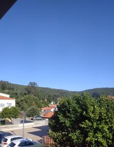 a view of a parking lot with cars parked at Voga Voga in Corcubión